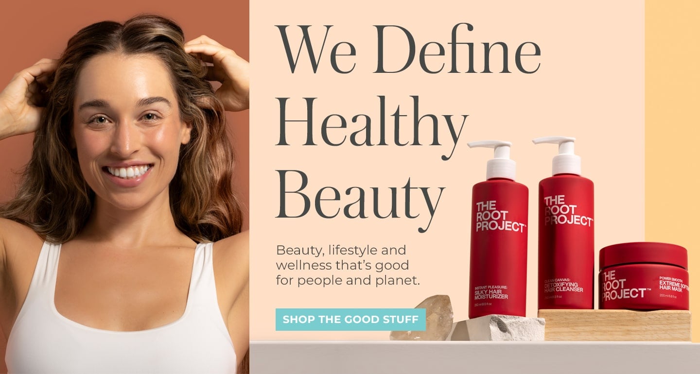 Beauty Heroes: We Define Healthy Beauty | The Root Project | Group image of red bottles with white pumps on shelf on peach background