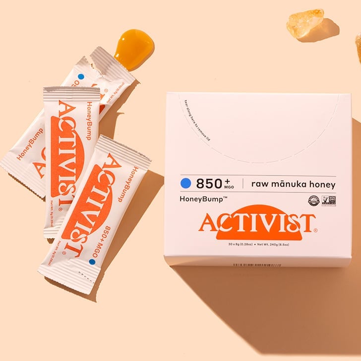Activist Manuka HoneyBump on peach showcasing external carton, white box, with three sachet's and product swatch