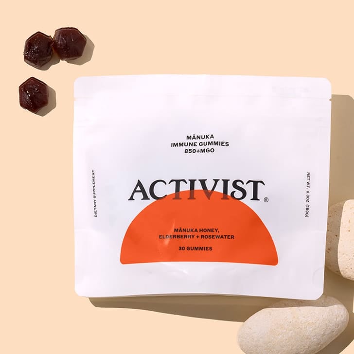 Activist | Manuka Immune Gummies | Dark gummies on peach background, white porch with red half circle on front.