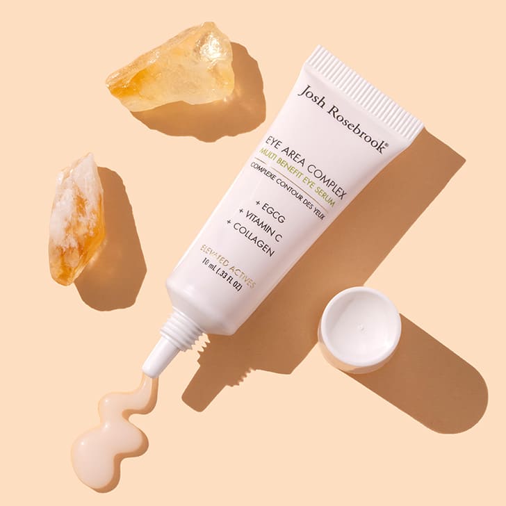 Josh Rosebrook | Eye Area Complex | Styled image flat lay with swatch, white tube with gel product coming out on peach background