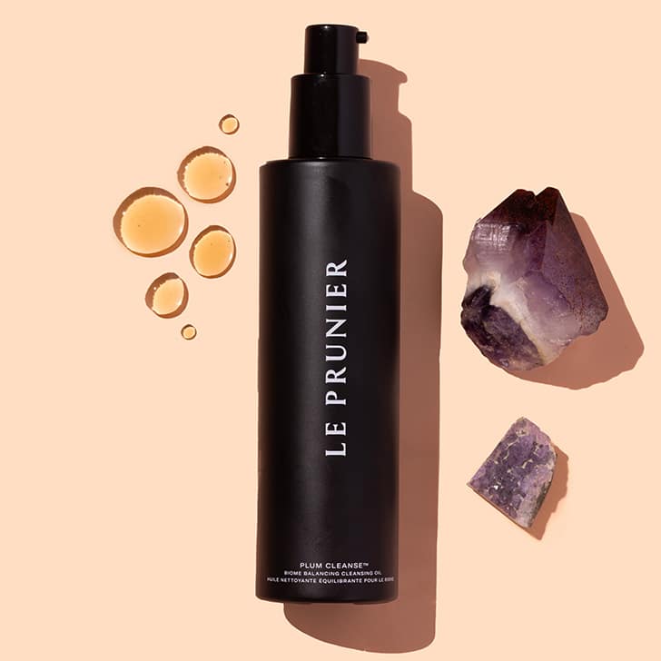 Le Prunier Plum Cleanse, product flat lay on beige background with swatch