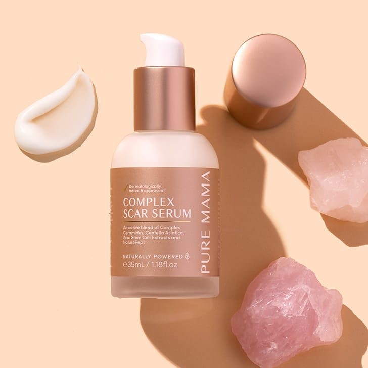 PURE MAMA Complex Scar Serum on peach background with white product swatch