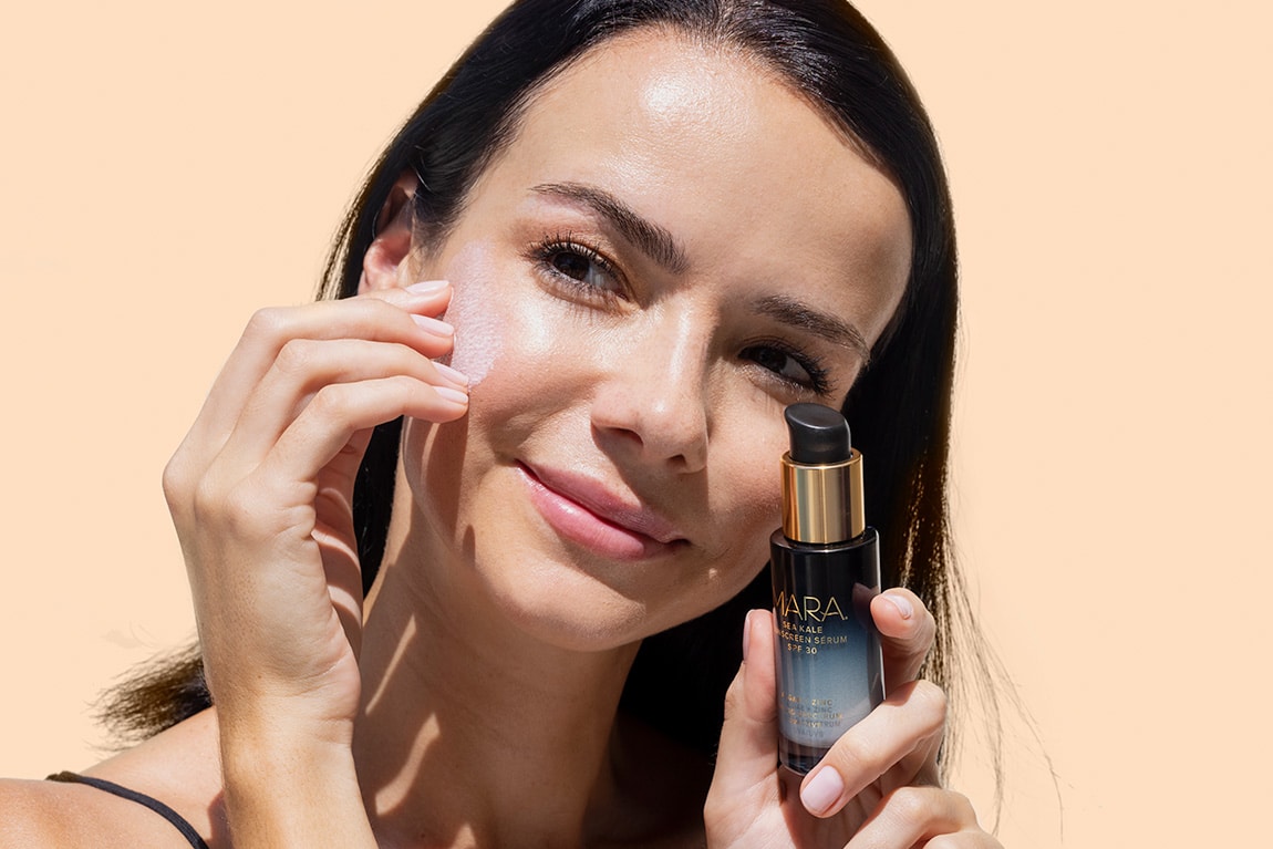 Woman Applying Mara Serum to Face
