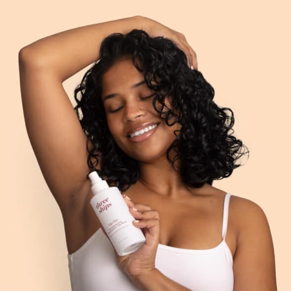 Model applying Three Ships product to underarm.